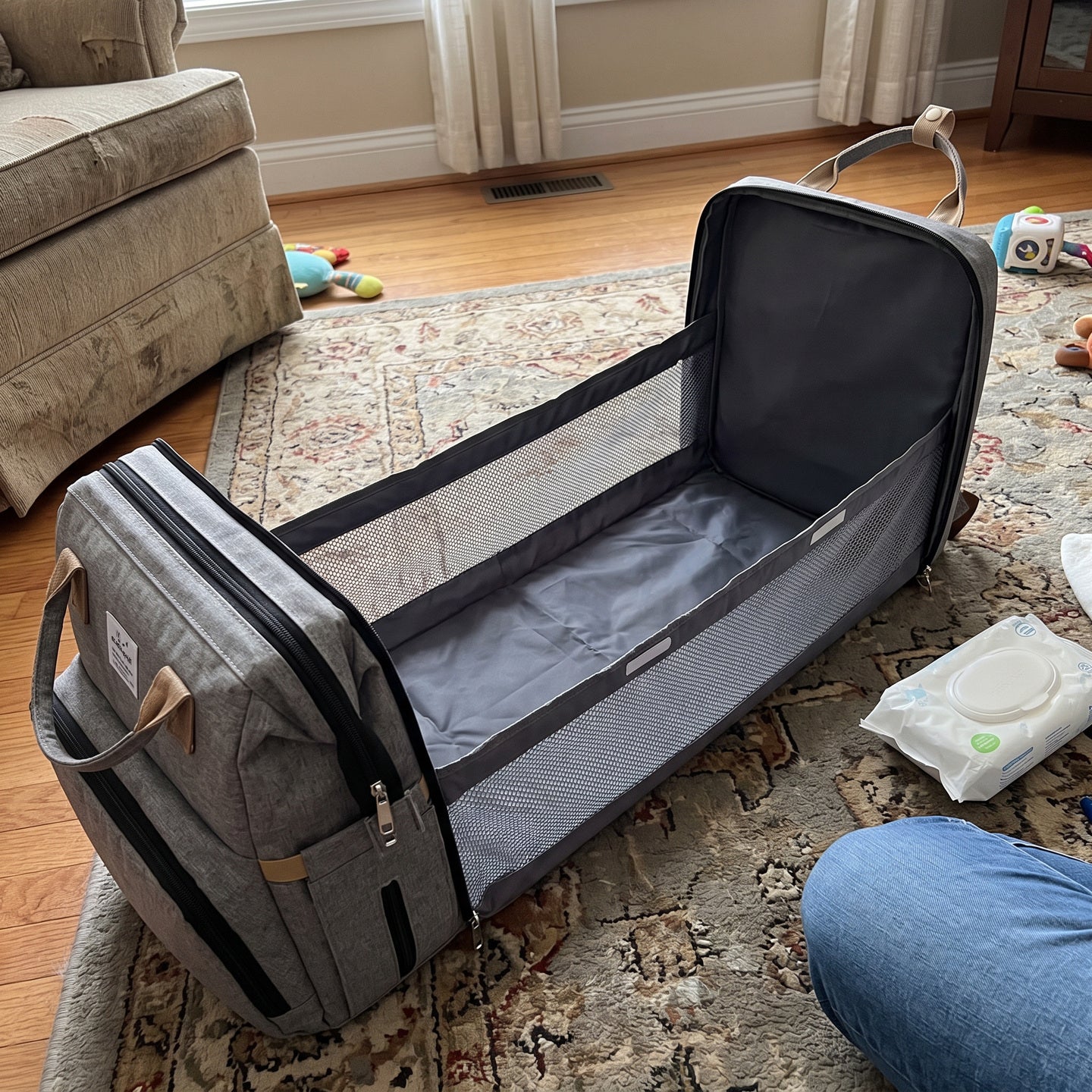 Open backpack with baby essentials visible